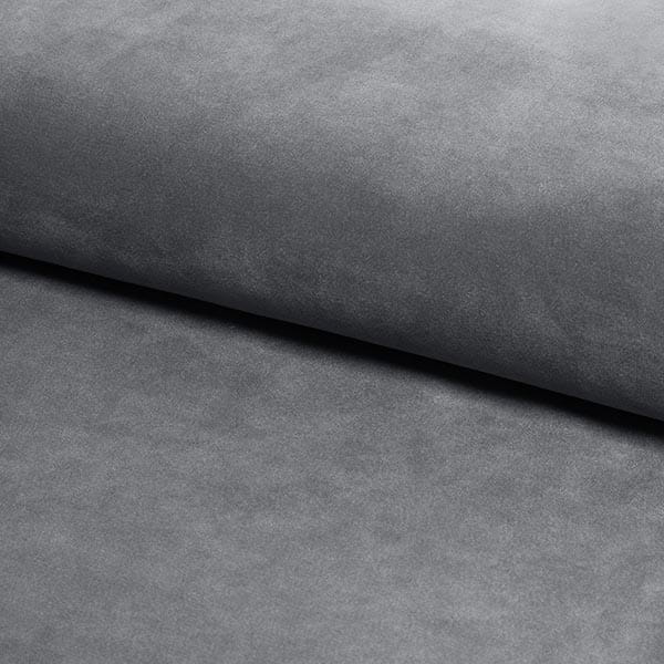 Nahaufnahme der grauen Stofftextur eines Boxspringbettes.