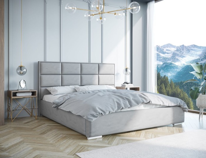 Modernes graues Polsterbett in hellem Schlafzimmer mit Bergblick und Fischgrätparkett.