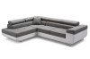 Großzügige Wohnlandschaft in Grau und Weiß, L-Form Sofa mit modernem Design.