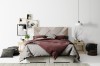 Modernes Schlafzimmer-Design mit elegantem Bett, Wandbildern und gemütlicher Atmosphäre.
