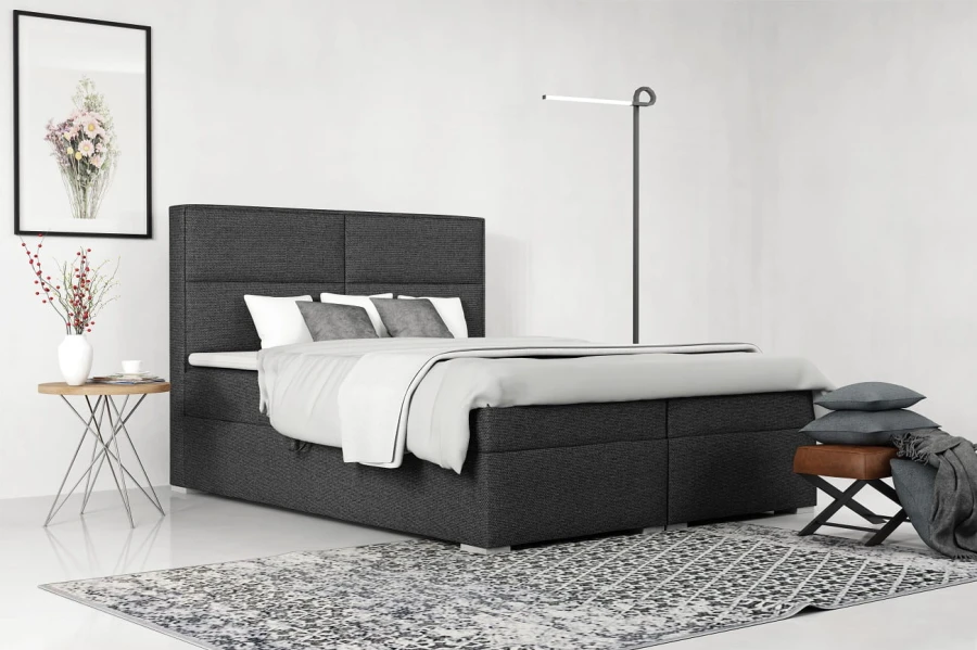 Dunkelgraues Boxspringbett in Anthrazit für ein elegantes und gemütliches Schlafzimmer.