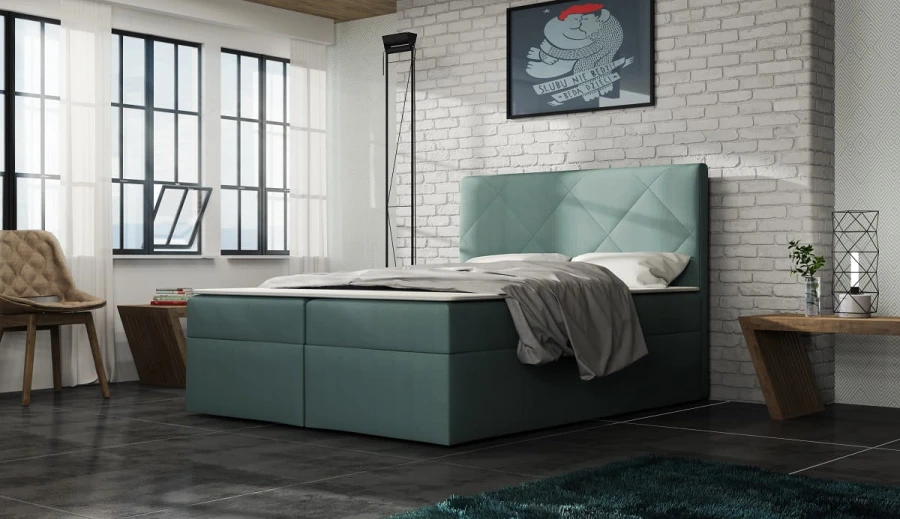 Petrolfarbenes Boxspringbett mit modernem Design im Schlafzimmer mit Loft-Stil.