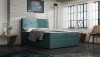 Boxspringbett in Petrol mit hohem, gestepptem Kopfteil für ein stilvolles Schlafzimmer.