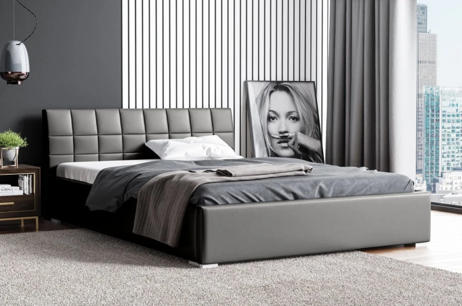 Modernes graues Polsterbett mit gestepptem Kopfteil in einem stilvollen Schlafzimmer.