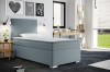 Hellblaues Boxspring-Einzelbett mit gestepptem Design in modernem Zimmer mit Wanddekoration.