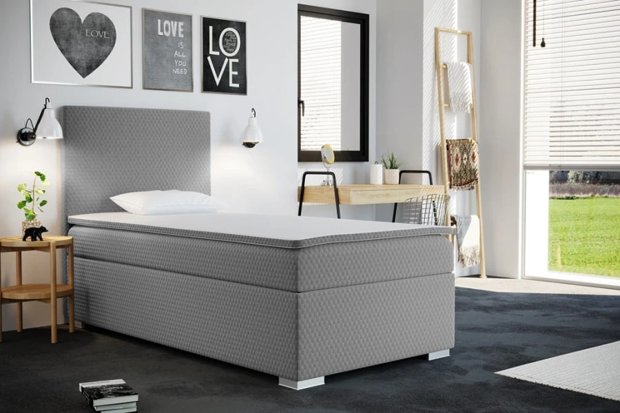 Graues Boxspringbett Einzelbett mit hohem Kopfteil für modernen Schlafkomfort.