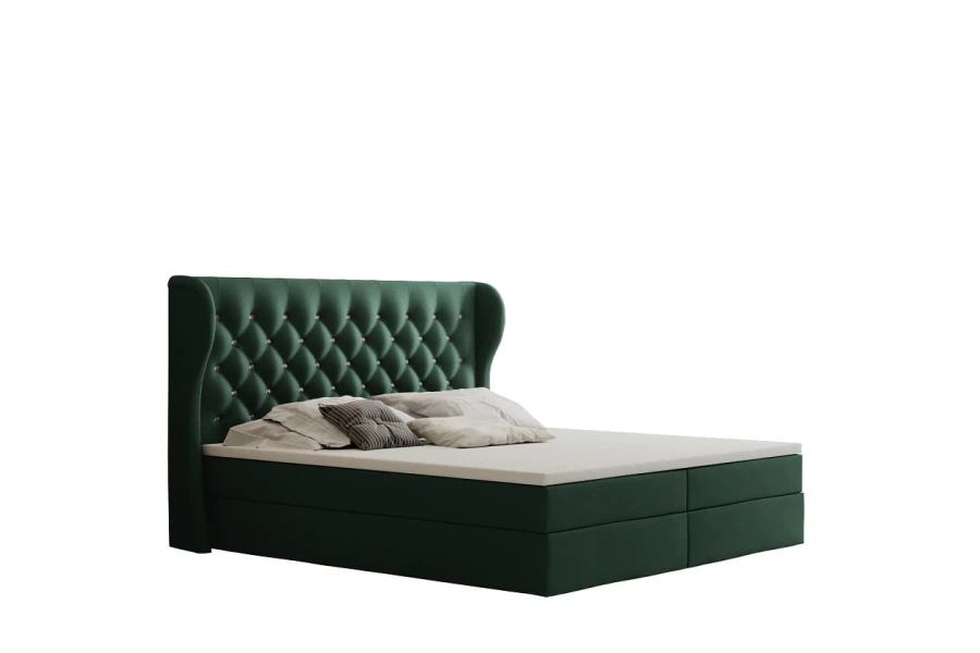 Grünes Boxspringbett mit gestepptem Kopfteil und Samtbezug.