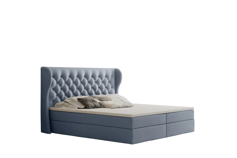 Hellblaues Boxspringbett in eleganter Samtoptik mit Bettkasten.