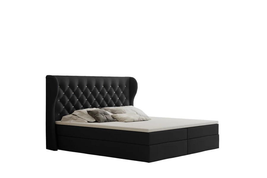 Schwarzes Boxspringbett mit stilvoller Chesterfield-Steppung.