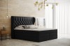 Elegantes schwarzes Boxspringbett mit hohem gepolstertem Kopfteil.