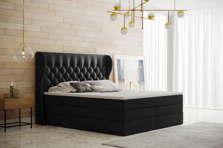 Elegantes schwarzes Boxspringbett mit hohem gepolstertem Kopfteil.