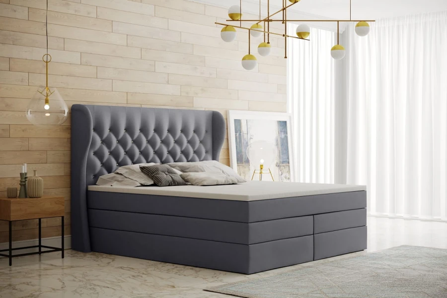 Graues Boxspringbett in modernem Schlafzimmer mit Holzoptik-Wand