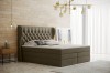 Taupefarbenes Boxspringbett in modernem Schlafzimmerambiente