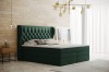 Boxspringbett in Smaragdgrün mit gestepptem Kopfteil und Glitzersteinen im modernen Schlafzimmer.