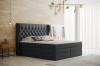 Modernes Boxspringbett in Anthrazit mit stilvollem Knopf-Design am Kopfteil.