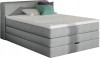 Modernes graues Boxspringbett mit Kissen und weißer Matratze in perspektivischer Ansicht.