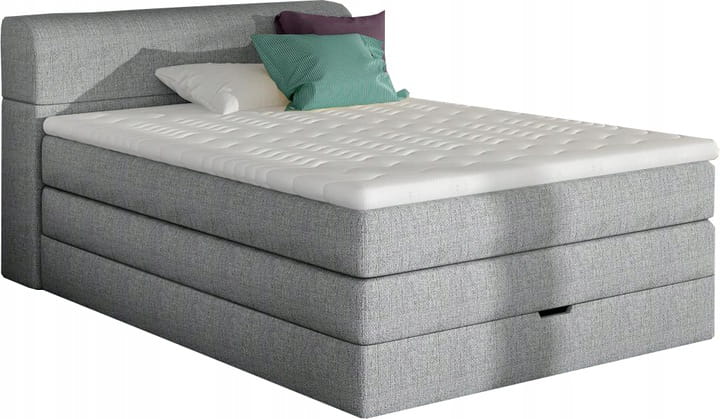 Modernes graues Boxspringbett mit Kissen und weißer Matratze in perspektivischer Ansicht.