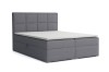 Dunkelgraues Boxspringbett mit gestepptem Kopfteil auf weißem Hintergrund.