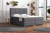 Anthrazitfarbenes Boxspringbett im modernen Schlafzimmer-Ambiente.