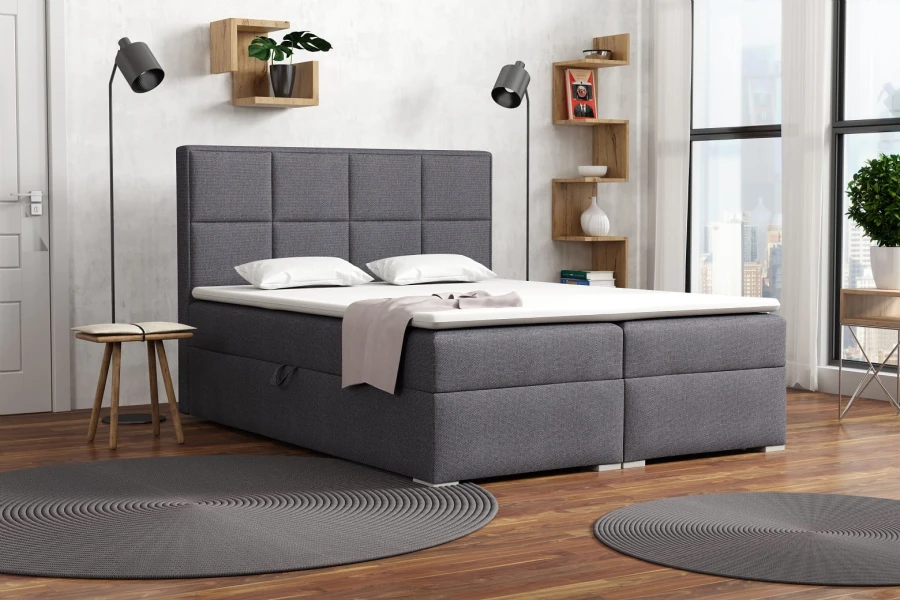 Anthrazitfarbenes Boxspringbett im modernen Schlafzimmer-Ambiente.