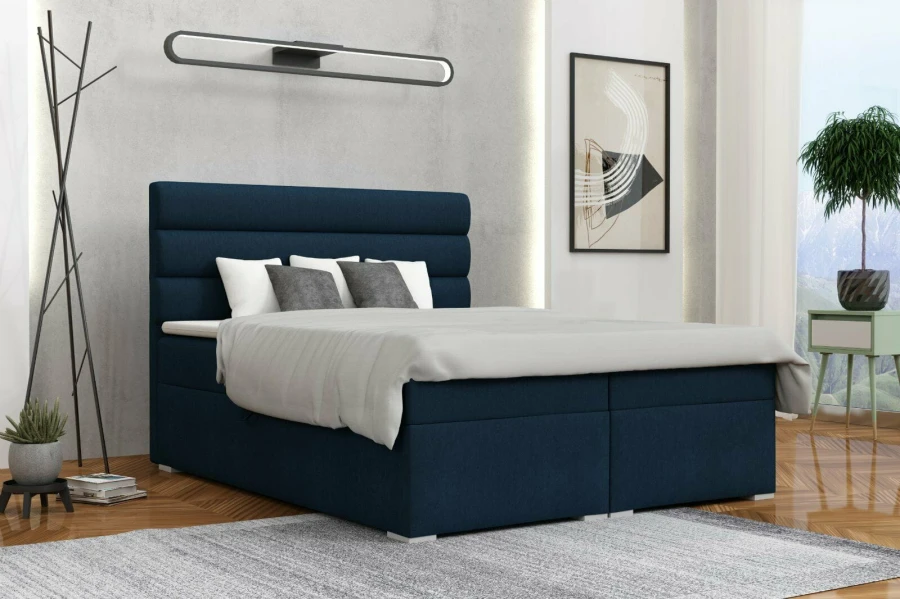 Blaues Boxspringbett mit gepolstertem Kopfteil in modernem Schlafzimmer-Design