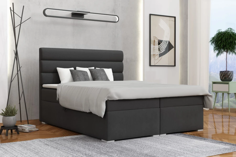 Stilvolles dunkelgraues Boxspringbett in einem hellen, modernen Schlafzimmer