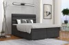 Modernes Boxspringbett in Dunkelgrau mit gemütlichen Kissen und Kopfteil
