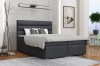 Dunkelgraues Boxspringbett mit horizontal gestepptem Kopfteil in modernem Schlafzimmer.