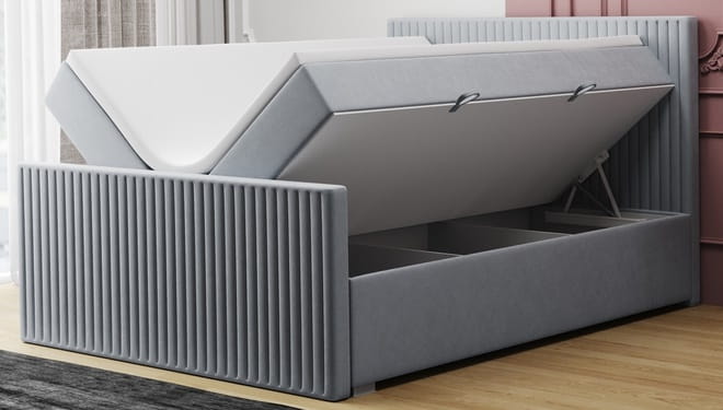 Graues Bett mit offenem Bettkasten für zusätzlichen Stauraum im Schlafzimmer.