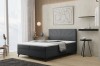 Elegantes dunkelgraues Boxspringbett mit fächerförmiger Steppung am Kopfteil.