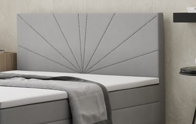 Gepolstertes graues Kopfteil mit eleganter Sonnenstrahl-Steppung für Betten.