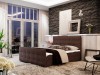 Braunes Boxspringbett mit eleganter Steppung in gemütlicher Schlafzimmer-Atmosphäre.