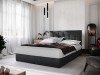 Dunkelgraues Boxspringbett mit gestepptem Kopfteil in modernem Ambiente.
