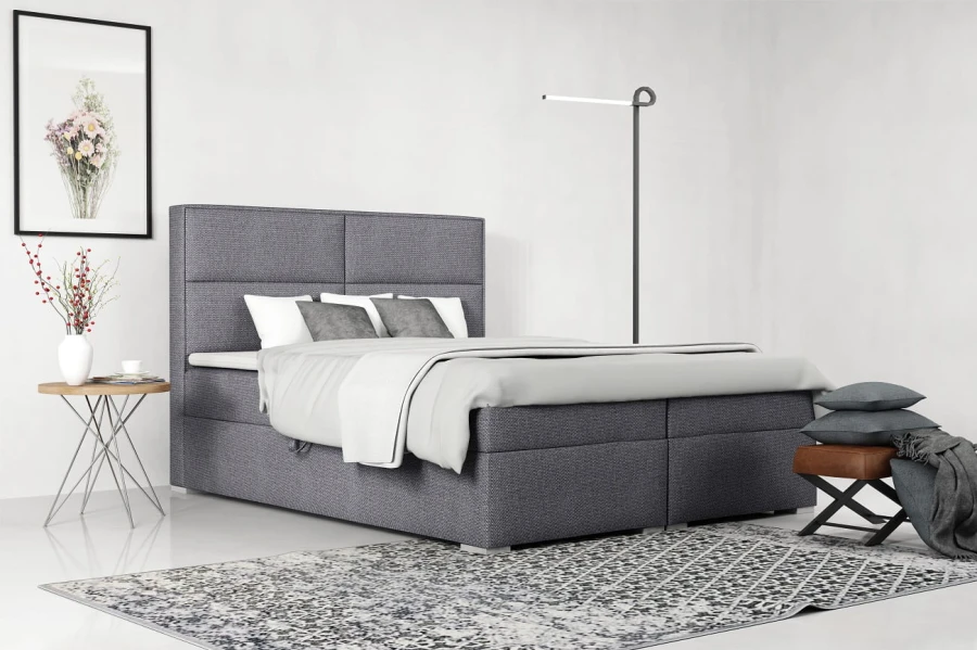 Anthrazitfarbenes Boxspringbett im minimalistischen Schlafzimmer.