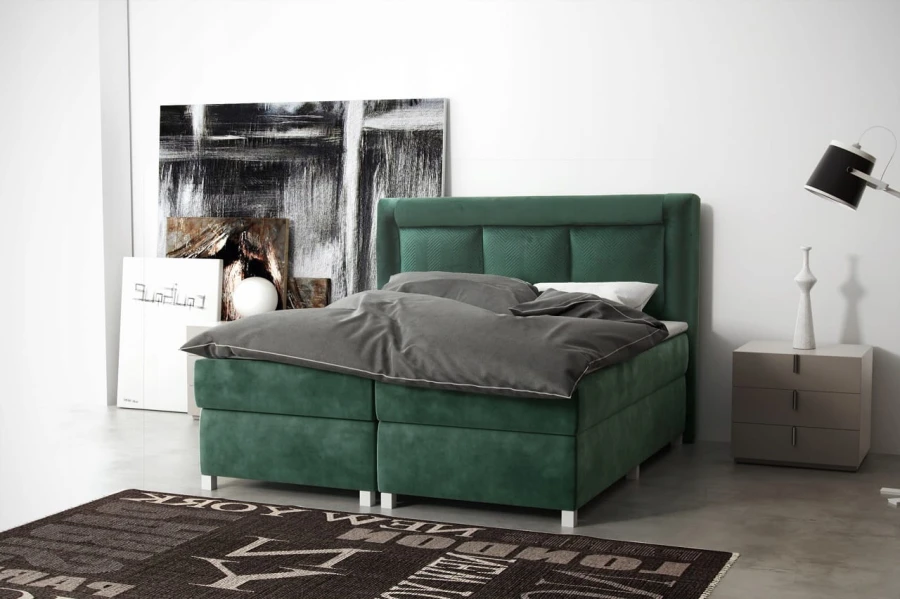 Grünes Boxspringbett aus Samt mit grauem Bettzeug in modernem Ambiente.