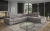 Elegantes anthrazitfarbenes Ecksofa in modernem Ambiente mit Glas-Couchtisch.