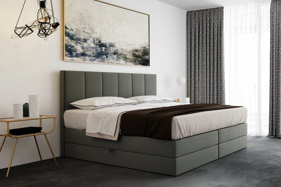 Modernes graues Polsterbett mit hohem Kopfteil und praktischem Bettkasten im Schlafzimmer.