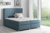 Blaues Boxspringbett mit gestepptem Kopfteil und weißer Matratze