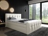 Modernes cremefarbenes Polsterbett mit gestepptem Kopfteil im Schlafzimmer mit Waldblick.