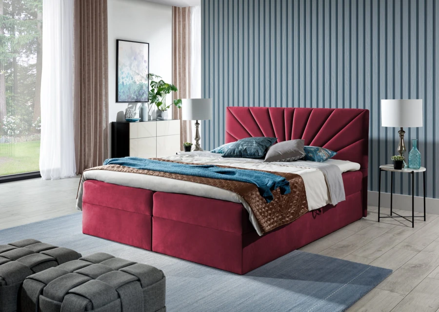 Rotes Boxspringbett mit elegantem fächerförmigem Kopfteil in einem hellen, modernen Schlafzimmer.