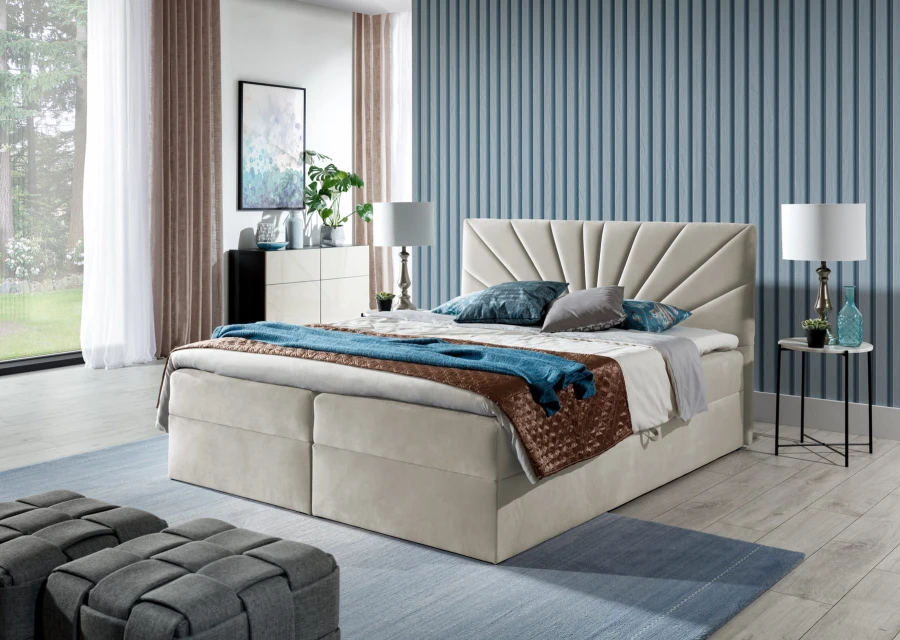 Beiges Boxspringbett mit gefächertem Kopfteil in einem modern eingerichteten Schlafzimmer.