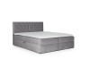 Graues Boxspringbett aus Samt mit strahlenförmig gestepptem Kopfteil vor weißem Hintergrund.