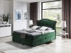 Grünes Boxspringbett aus Samt mit geschwungenem Kopfteil in modernem Schlafzimmer.