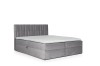 Graues Boxspringbett mit weißem Topper und gestepptem Kopfteil vor weißem Hintergrund