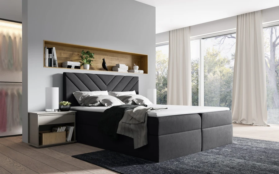 Anthrazitfarbenes Boxspringbett in modernem Schlafzimmer mit stilvoller Wandnische.