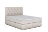 Beiges Boxspringbett mit Chesterfield-Knopfheftung am Kopfteil freigestellt.