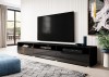 Stilvolles schwarzes TV-Möbel auf dem Boden stehend in einem hellen, modernen Wohnzimmer.