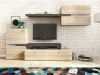Moderne Wohnwand in Eiche-Optik und Anthrazit vor weißer Ziegelwand mit TV-Board.