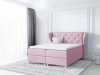 Rosa Boxspringbett mit Ohrensessel-Kopfteil in einem stilvoll eingerichteten Raum.