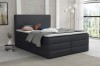 Modernes Boxspringbett in Anthrazit mit gepolstertem Kopfteil für ein stilvolles Schlafzimmer.